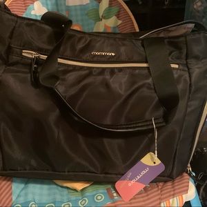Mommore breast pump diaper bag. New with tags. Some much space and cute design.